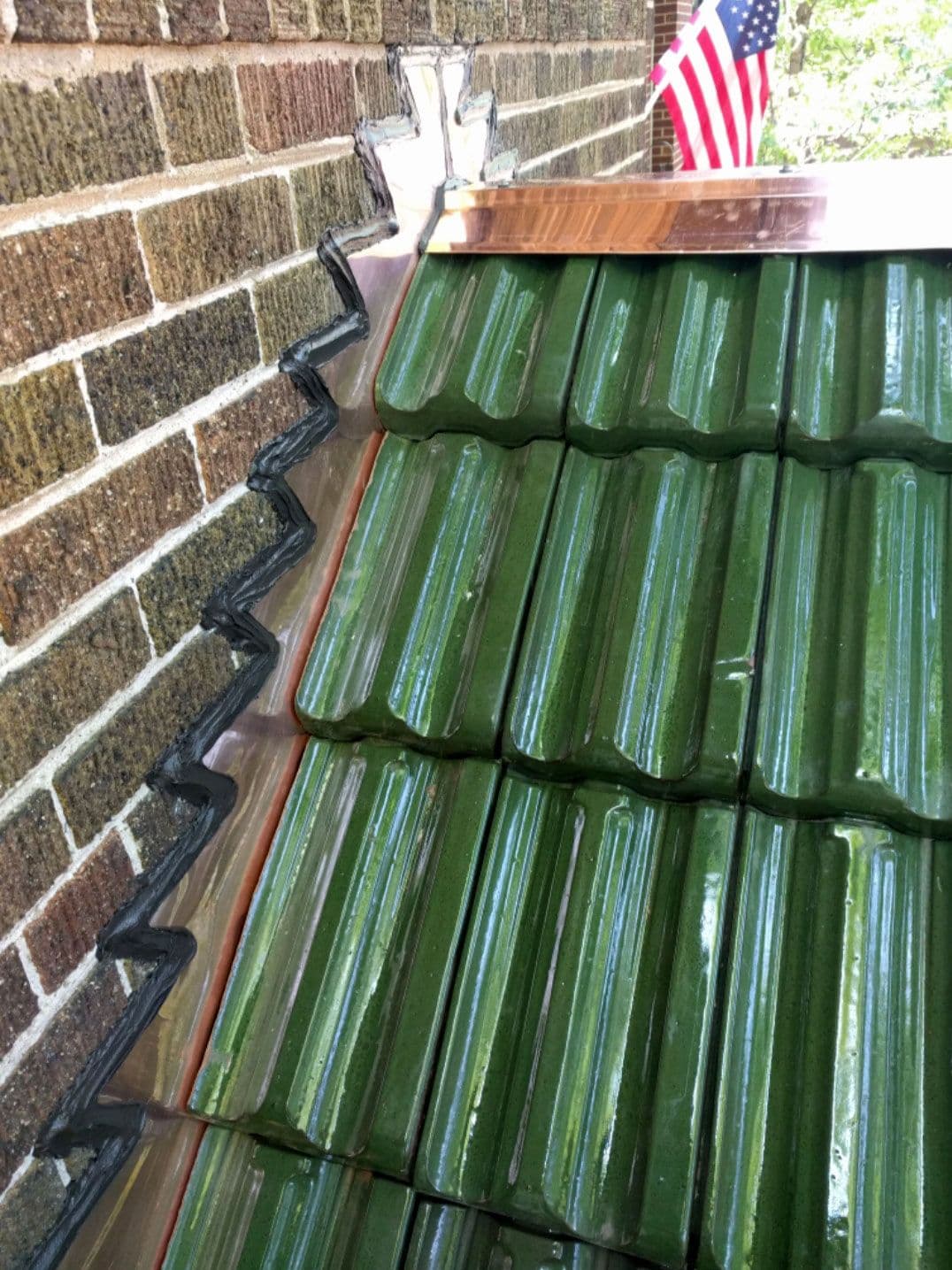 Tile roofing: Installation of a new green glazed clay tile roof.