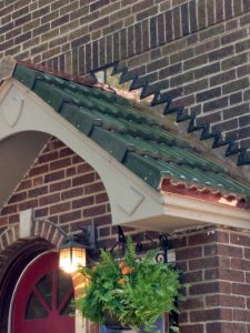 Tile porch roof with copper flashings