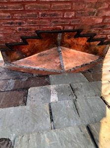 Copper flashings on slate roof